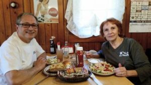 Enjoying an Old Log Cabin meal